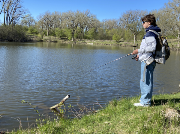 Sophomore Ricky Ozmun fishes for bass at Skokie Lagoons
